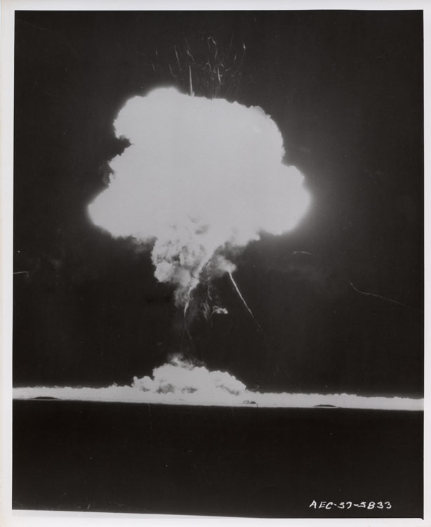 Fireball of Shot Laplace, 18th nuclear test of Operation Plumbbob, balloon detonation at 750 feet, Yucca Flat, NTS, 8 September 1957. Rope Trick Effect visible as cable streaks radiating from fireball. LASL Fleegle all-oralloy gun-type device, 1 kt. Lookout Mountain Laboratory, USAF. AEC-57-5833.