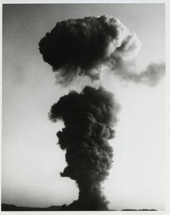 Mushroom cloud from Shot Stokes rising above Yucca Flat, Nevada Test Site, 7 August 1957. Balloon detonation at 1,500 feet, 19 kt. Cloud separating from stem at peak altitude. Operation Plumbbob. Lookout Mountain Laboratory, USAF. Catalog No. 5805.