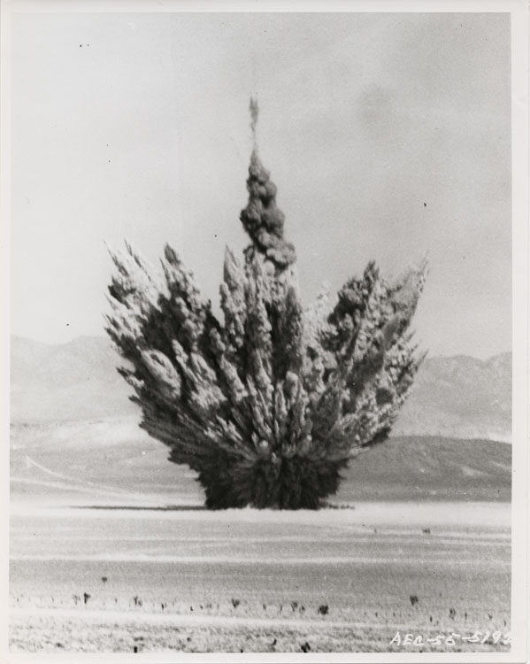 Shot Ess, Operation Teapot — sub-surface atomic-demolition cratering shot buried 20 metres, Nevada Test Site (Area 10, Yucca Flat), 23 March 1955; yield 1.2 kilotonnes. Credit: Air Photographic and Charting Service, Military Air Transport Service (USAF). Catalogue no. strangelove-1578.