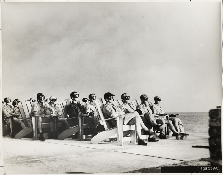 Observers at Shot Dog, Operation Greenhouse — VIPs seated on Parry Island watching the 81-kilotonne tower detonation on Runit Island, Enewetak Atoll, 8 April 1951