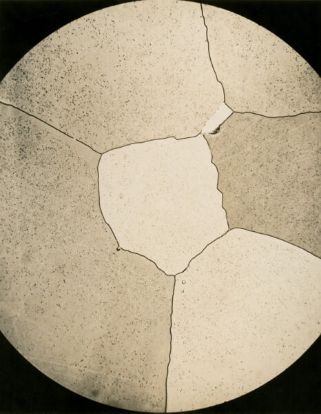 Photomicrograph of a uranium alloy thin section at 250x magnification, showing crystalline grain structure. Eldorado Nuclear Limited Metallographic Laboratory, 1968.