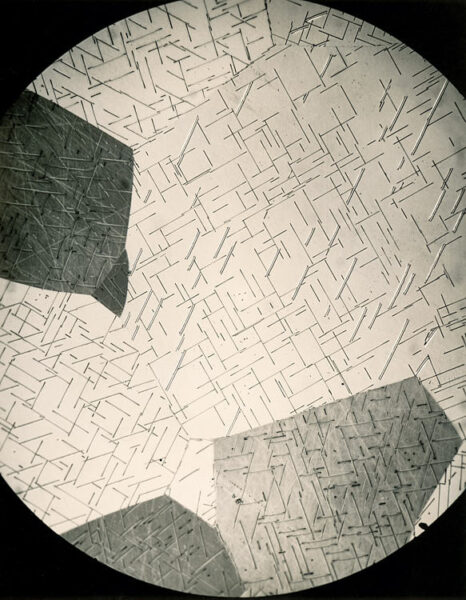 Photomicrograph of a uranium alloy thin section at 250x magnification, showing crystalline grain structure. Eldorado Nuclear Limited Metallographic Laboratory, 1968.